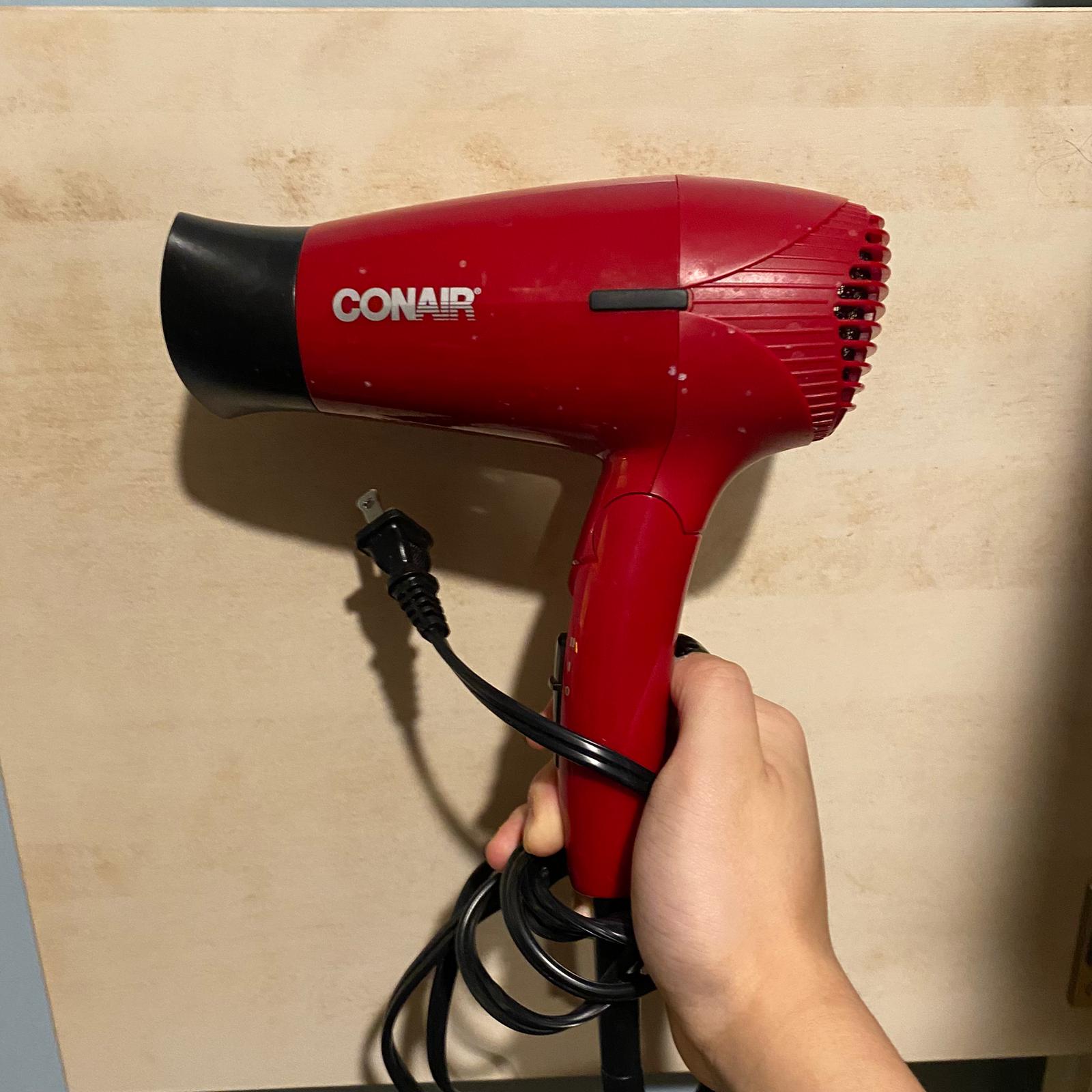 The sound of the hair dryer blowing air