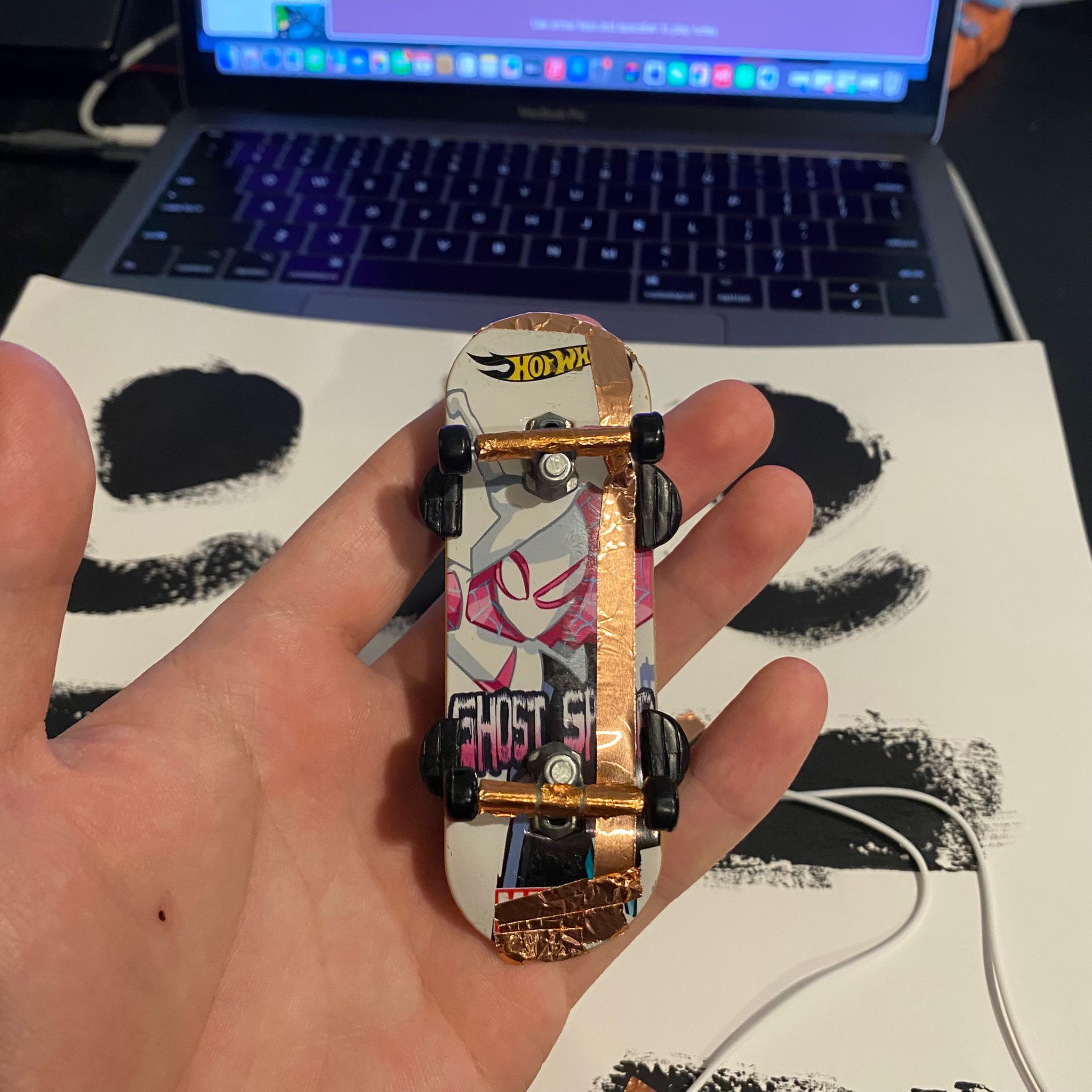 I tried to attach conductive tape to the finger-slide toy.
